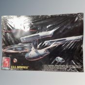 A Ertl USS Enterprise model kit, sealed.