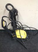 A Karcher B402 pressure washer with hose