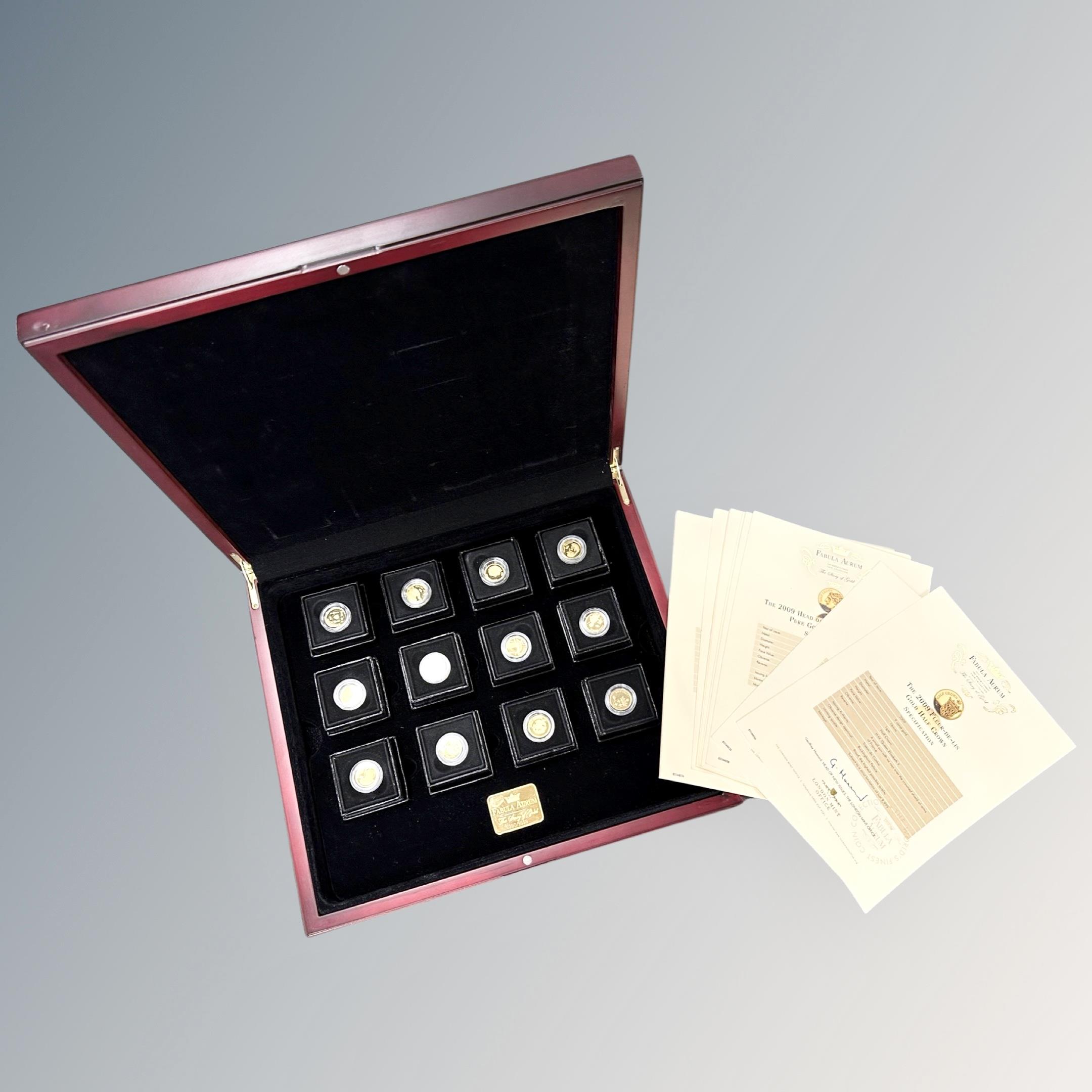A Fabula Aurum 9ct gold half crown collection, twelve 9ct gold coins each weighing 1g,