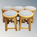 A set of five bar stools