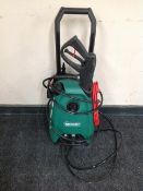 A Qualcast pressure washer with hose