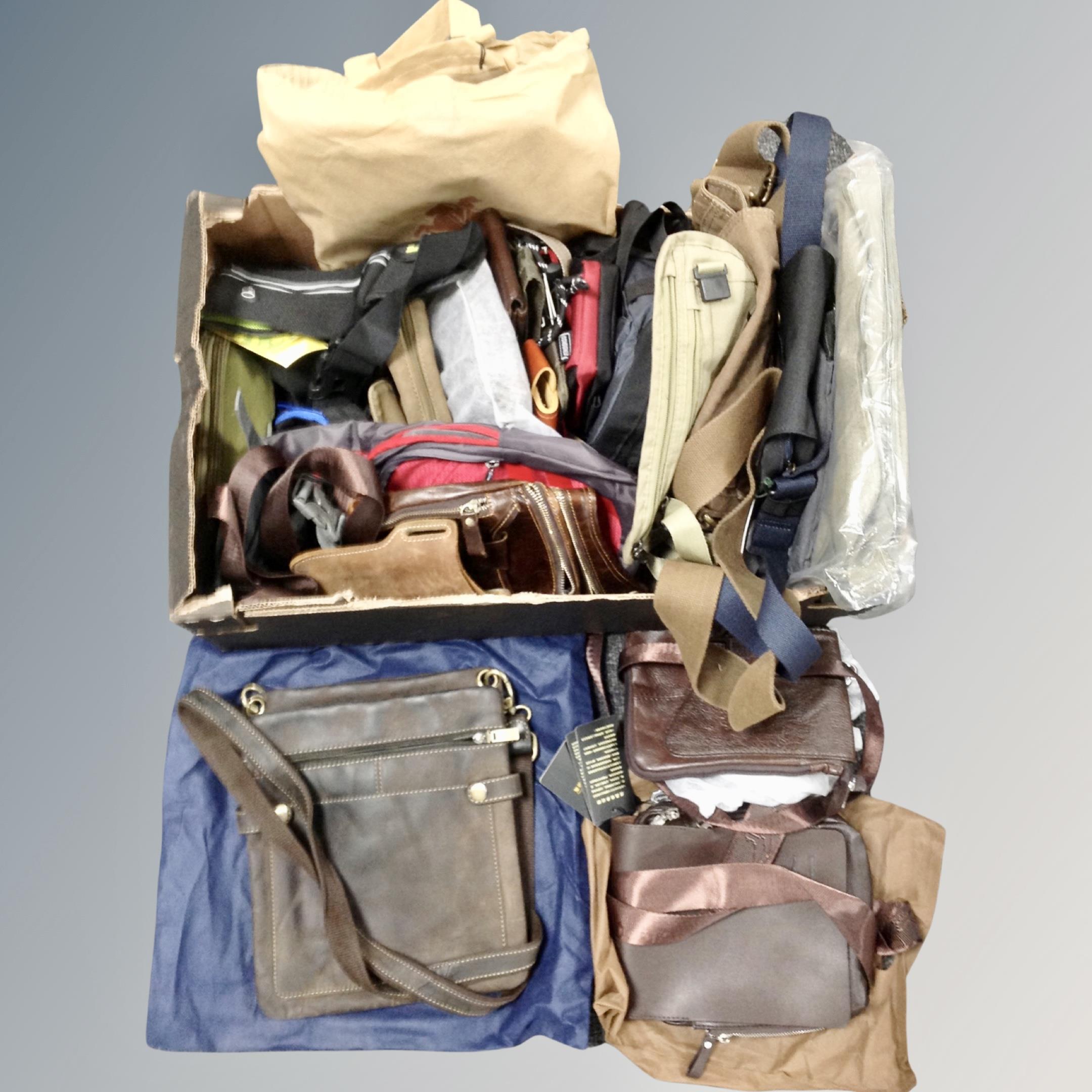 A box containing 30 assorted shoulder and bum-bags,