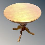 A contemporary circular pedestal table.