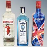 Three bottles of gin - Bombay Sapphire 100cl and Beefeater 1 litre and limited edition 1 litre.