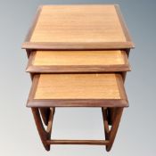 A nest of three 20th century G-Plan teak tables