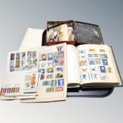 A stamp album including first day cover and a quantity of loose stamps.