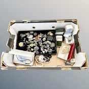 A box containing costume jewellery, wristwatches,