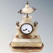A Victorian gilt alabaster mantel clock on wooden stand