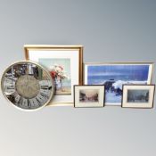 A circular mirrored battery operated wall clock together with four framed prints