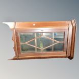 A Victorian inlaid mahogany wall mounted curio cabinet