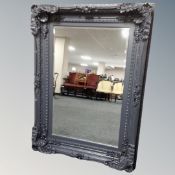 A Victorian style ornate overmantel mirror in painted frame,