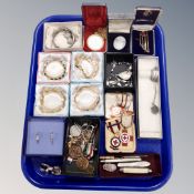 A tray of costume jewellery, gilt metal bangles, pen knives, pendants, cameo,