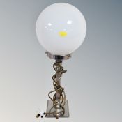 A chrome Art Deco table lamp with opaque ball shade