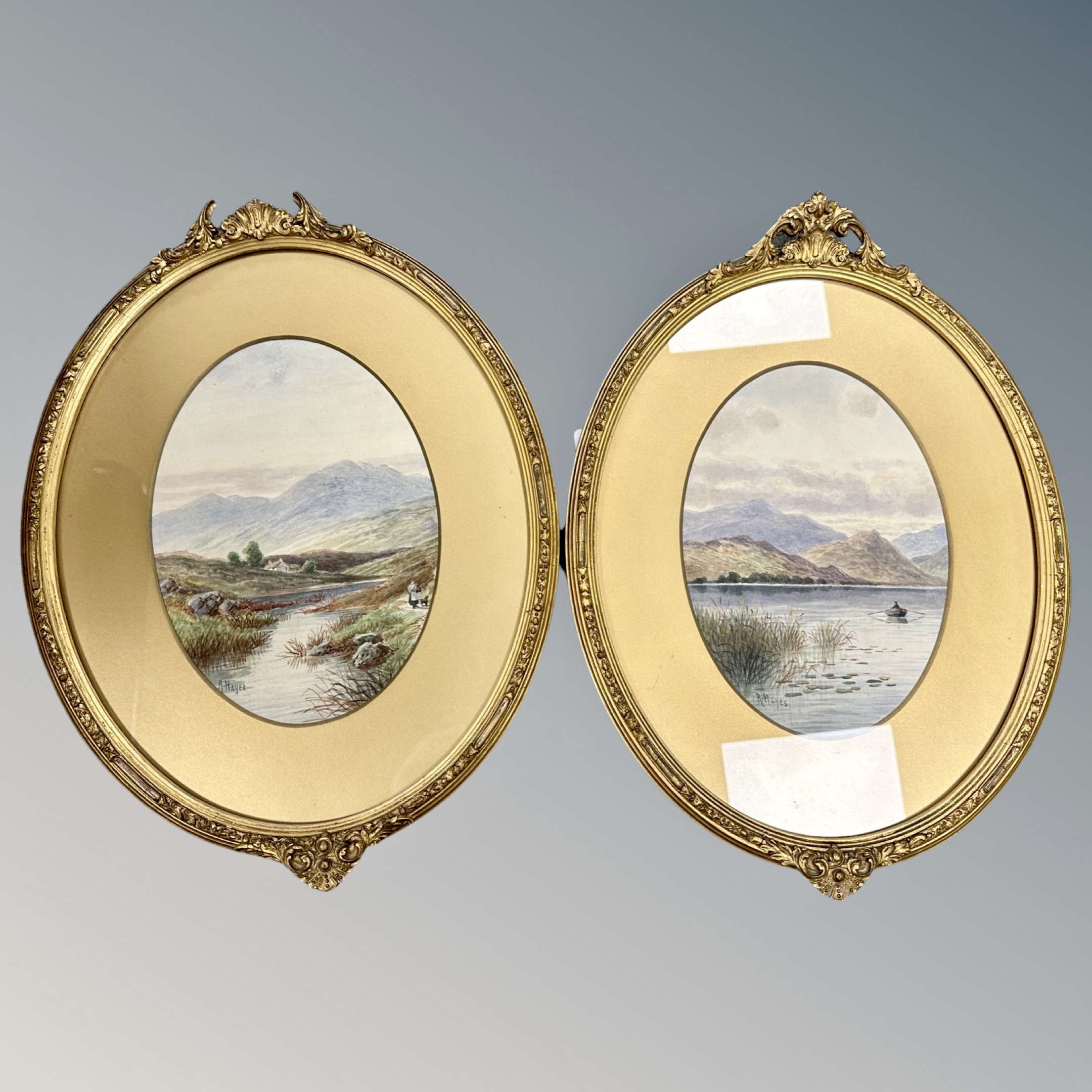 A pair of gilt framed watercolour signed R Hayes.