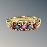 An 18ct gold sapphire and ruby half-eternity ring, size P CONDITION REPORT: 4.