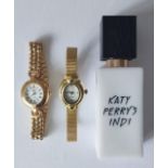 A Katy Perry's Indi 30 ml eau de parfum and 2 gold tone watches fitted with new batteries