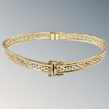 A 9ct gold three-tone gold bangle (misshapen) CONDITION REPORT: 10g