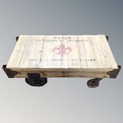 A contemporary coffee table in the form of a French porter's trolley,