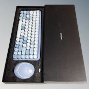 A Perixx wireless keyboard and mouse set with USB adaptor