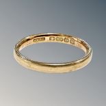 An 18ct gold band ring, size L CONDITION REPORT: 2.