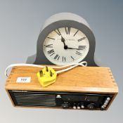A Laura Ashley clock together with a Roberts radio.