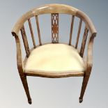 A 19th century inlaid mahogany tub armchair