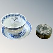 A Chinese jade seal, diameter 55 mm, together with a blue and white tea bowl with saucer.
