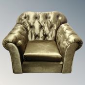 A Chesterfield armchair in faux velvet fabric