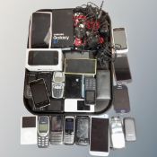 A tray of assorted mobile phones to include iPhone, Samsung, Nokia etc,