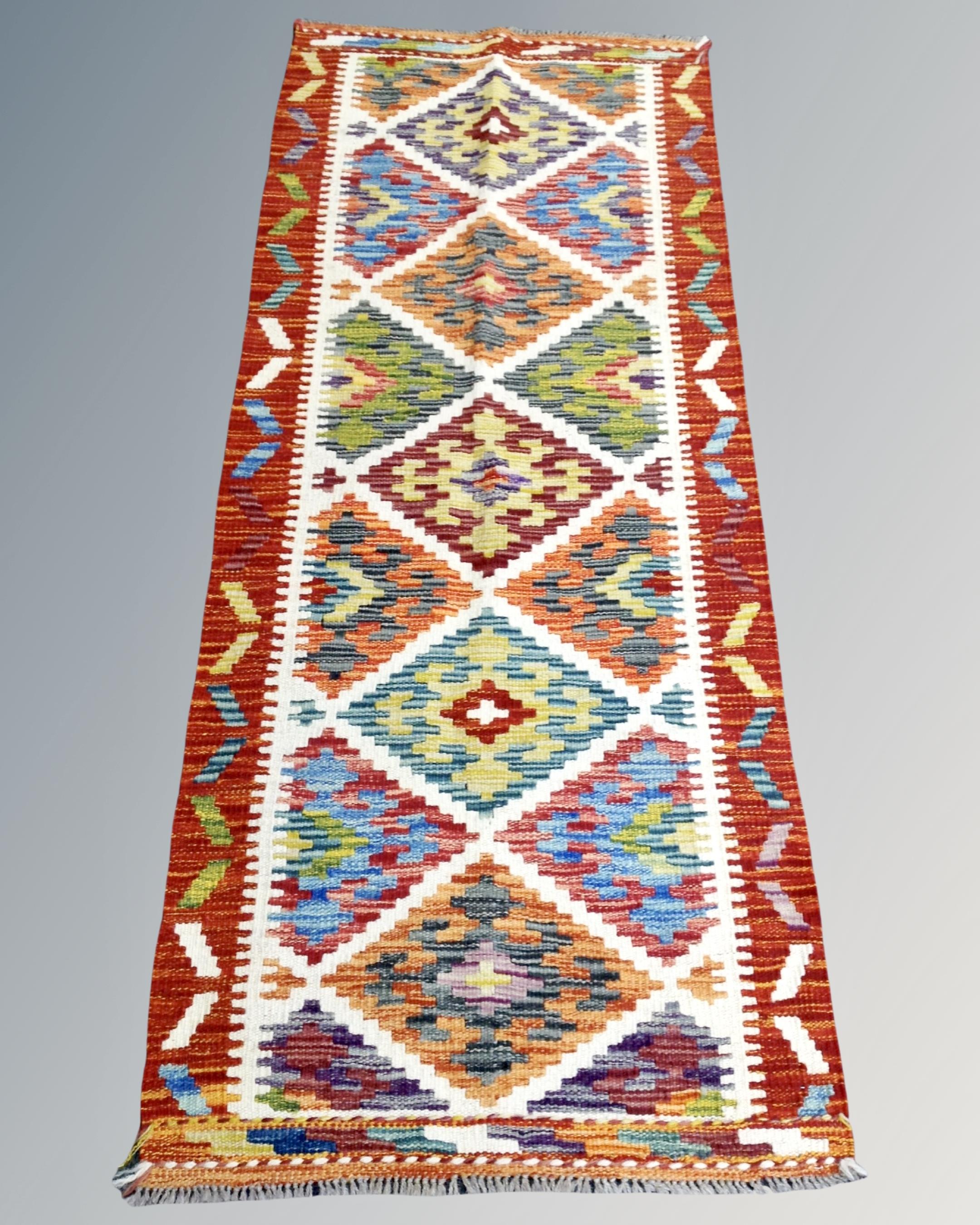 A Chobi kilim runner 161cm by 65cm