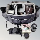 A camera bag containing Canon AE-1 camera,