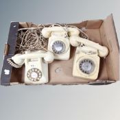 Two vintage cream Bakelite telephones together with a further similar telephone