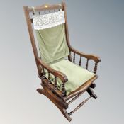 An Edwardian beech rocking chair