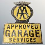 An aluminium AA approved garage services plaque