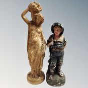 Two vintage pottery figures of a lady with wheat basket and boy