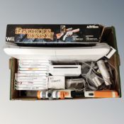 A box of Nintendo Wii games console with games, leads, controller, Wii fit board,