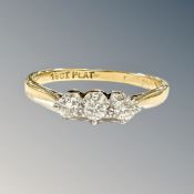 An 18ct gold and platinum three stone diamond ring, size Q CONDITION REPORT: 2.
