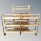 Three sets of folding shelves