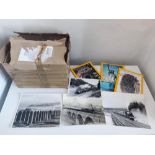 A box of 18 National geographic magazines and 25 vintage steam train photos