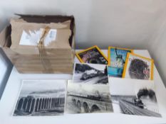 A box of 18 National geographic magazines and 25 vintage steam train photos