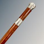 A Victorian malacca silver-mounted walking cane, the pommel engraved John Camozzi, Bicester, 1887,