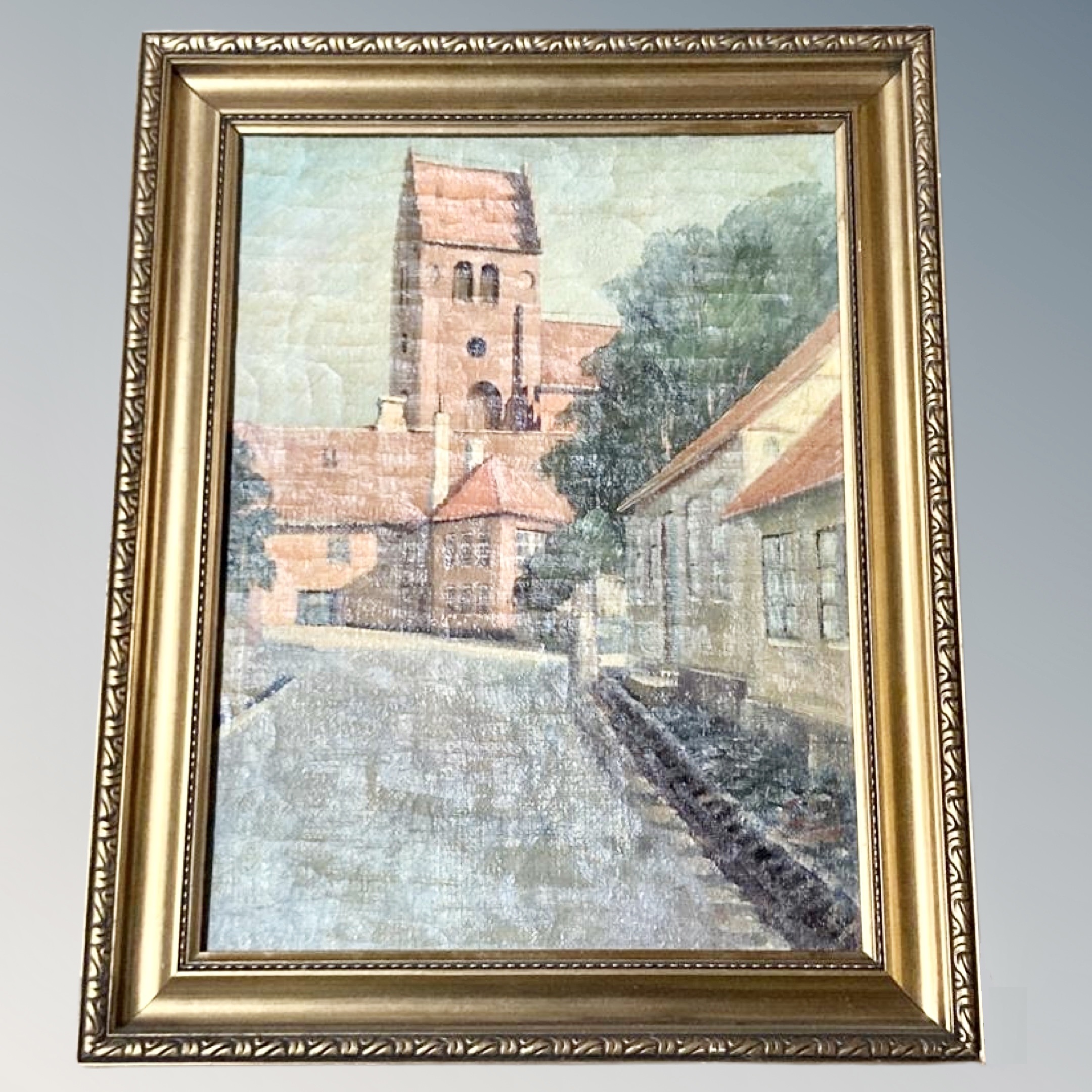 Twentieth century Continental School: Buildings in a street, oil on canvas, 53 cm x 39 cm. Framed.