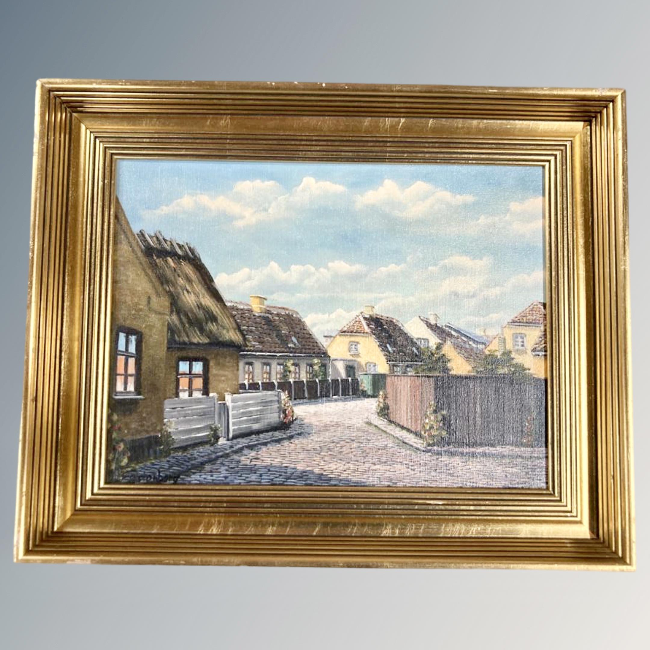 Twentieth century Continental School: A cobbled street scene, oil on canvas, 39 cm x 29 cm. Framed.