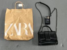 A Zara black top handled two-way bag (ne