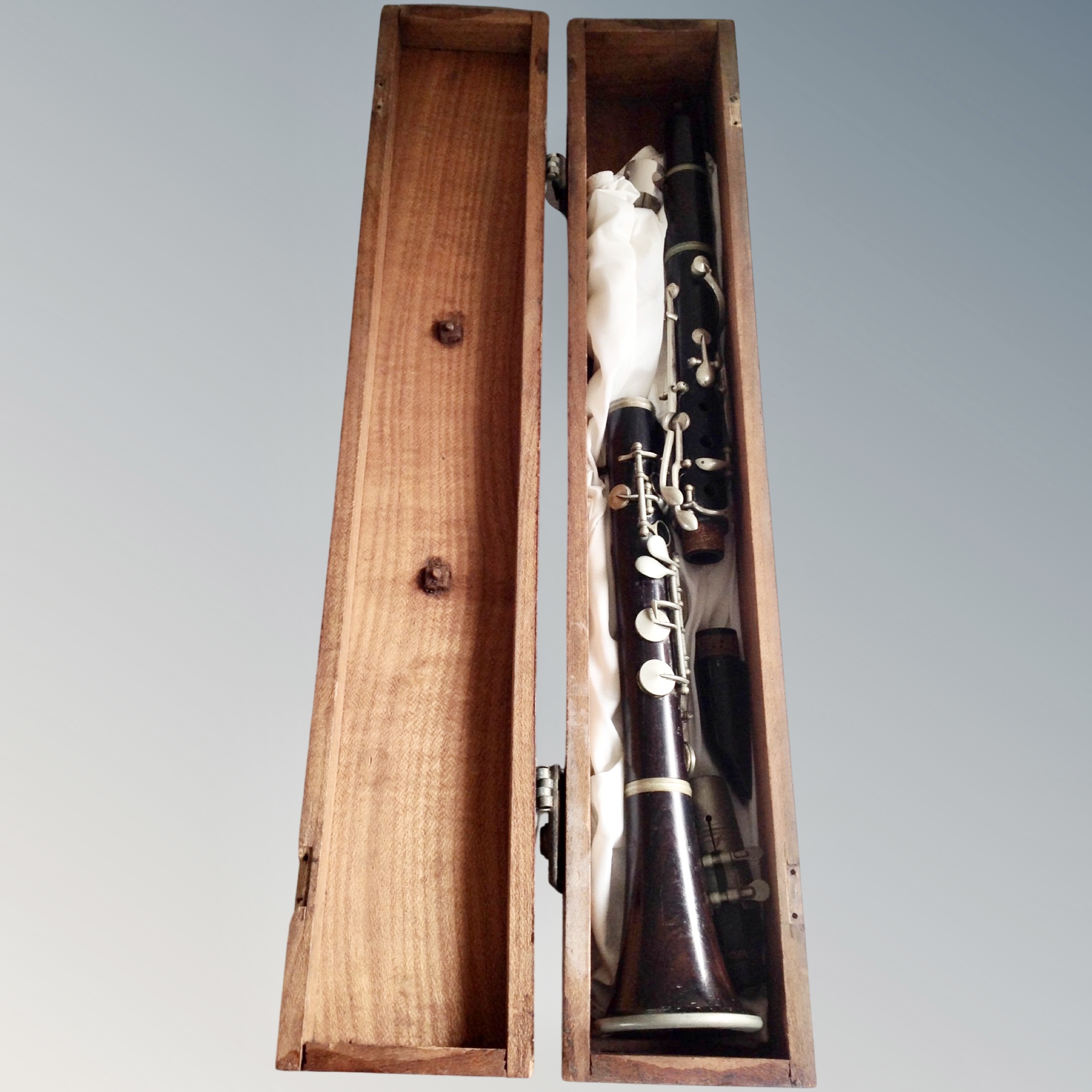 A vintage wooden clarinet by JTL of Paris, in wooden box.