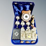 A tray containing pottery figures and antique cut glass cruet set on silver plated stand,