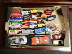 A box containing unboxed die cast vehicles including Corgi and Oxford die cast delivery vans and