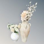 Two contemporary vases containing a quantity of dried flowers.