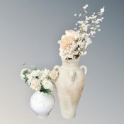 Two contemporary vases containing a quantity of dried flowers.