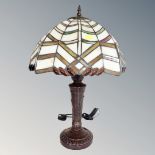 A Tiffany style table lamp with leaded glass shade